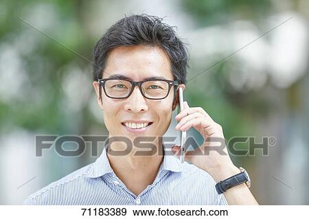 Japanese businessman downtown Tokyo View Large Photo Image Stock Photo - Japanese businessman downtown Tokyo. Fotosearch