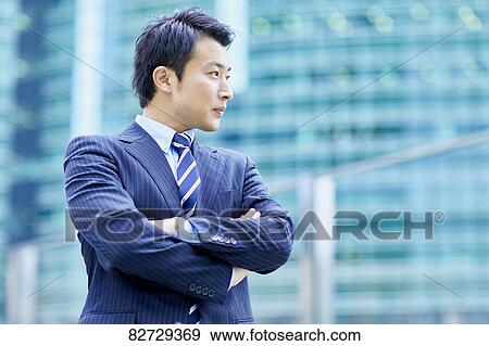 Japanese businessman downtown Tokyo View Large Photo Image Stock Photo - Japanese businessman downtown Tokyo. Fotosearch
