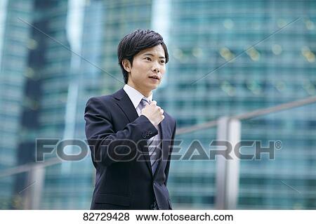 Japanese businessman downtown Tokyo View Large Photo Image Stock Photo - Japanese businessman downtown Tokyo. Fotosearch