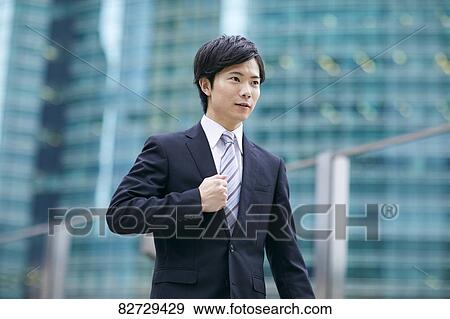 Stock Photo - Japanese businessman downtown Tokyo. Fotosearch