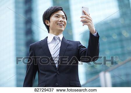 Japanese businessman downtown Tokyo View Large Photo Image Stock Photo - Japanese businessman downtown Tokyo. Fotosearch
