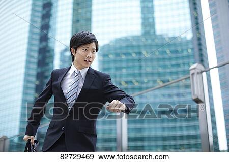 Japanese businessman downtown Tokyo View Large Photo Image Stock Photo - Japanese businessman downtown Tokyo. Fotosearch