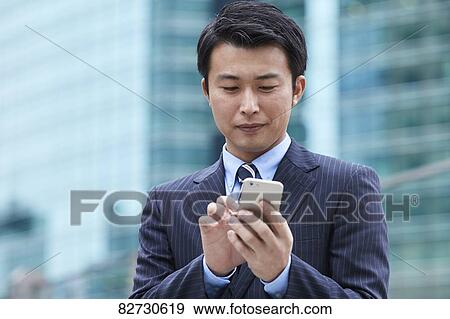 Japanese businessman downtown Tokyo View Large Photo Image Stock Photo - Japanese businessman downtown Tokyo. Fotosearch