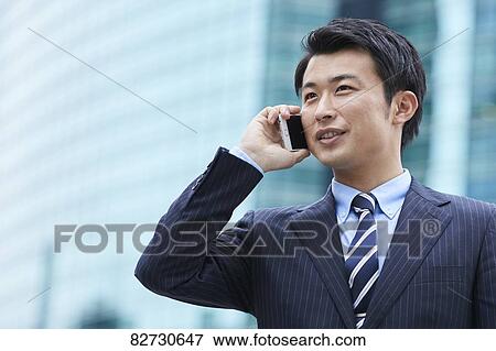 Stock Photo - Japanese businessman downtown Tokyo. Fotosearch