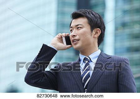 Japanese businessman downtown Tokyo View Large Photo Image Stock Photo - Japanese businessman downtown Tokyo. Fotosearch