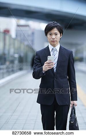 Stock Photo - Japanese businessman downtown Tokyo. Fotosearch