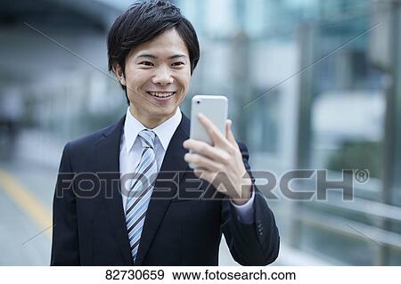 Japanese businessman downtown Tokyo View Large Photo Image Stock Photo - Japanese businessman downtown Tokyo. Fotosearch