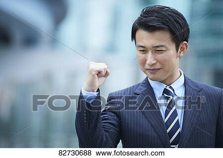 Stock Photo - Japanese businessman downtown Tokyo. Fotosearch