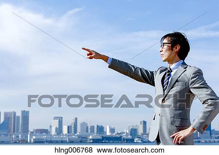 Stock Photo - Japanese businessman downtown Tokyo, Japan. Fotosearch