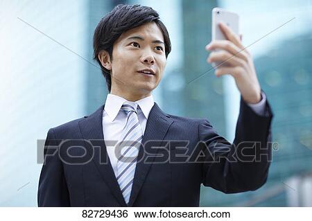 Japanese businessman downtown Tokyo View Large Photo Image Stock Photograph - Japanese businessman downtown Tokyo. Fotosearch