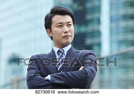 Stock Photograph - Japanese businessman downtown Tokyo. Fotosearch