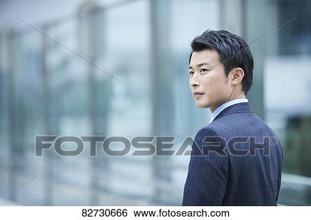 Japanese businessman downtown Tokyo View Large Photo Image Stock Photograph - Japanese businessman downtown Tokyo. Fotosearch