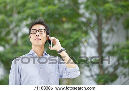 Stock Photography - Japanese businessman downtown Tokyo. Fotosearch