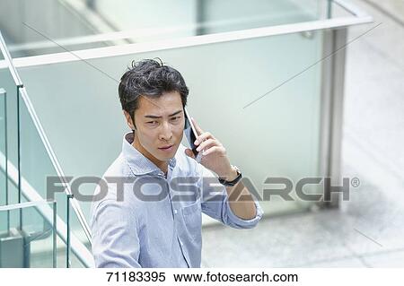 Stock Photography - Japanese businessman downtown Tokyo. Fotosearch