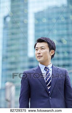 Stock Photography - Japanese businessman downtown Tokyo. Fotosearch