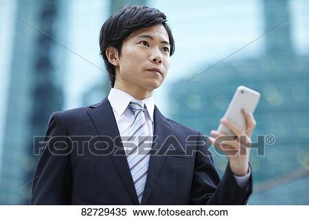 Japanese businessman downtown Tokyo View Large Photo Image Stock Photography - Japanese businessman downtown Tokyo. Fotosearch