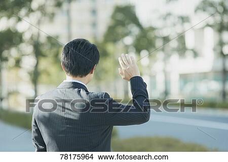 Japanese businessman going to work View Large Photo Image Picture - Japanese businessman going to work. Fotosearch