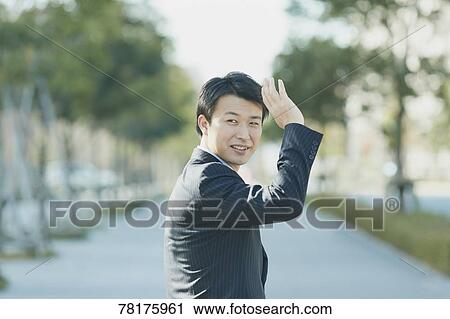 Stock Image - Japanese businessman going to work. Fotosearch