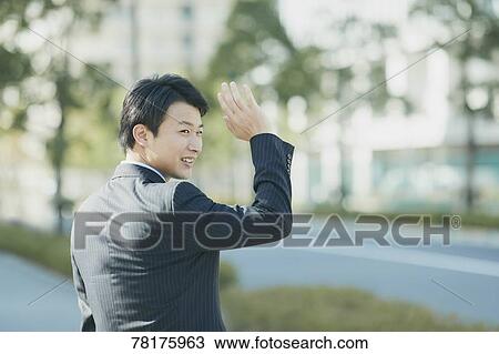 Stock Image - Japanese businessman going to work. Fotosearch