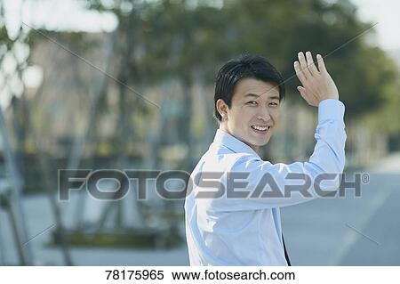 Stock Photography - Japanese businessman going to work. Fotosearch