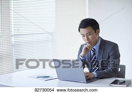 Japanese businessman in the office View Large Photo Image Picture - Japanese businessman in the office. Fotosearch