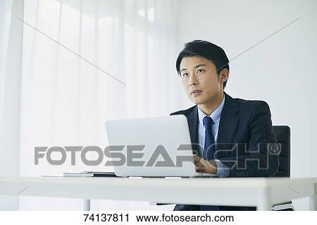 Japanese businessman in the office View Large Photo Image Stock Image - Japanese businessman in the office. Fotosearch