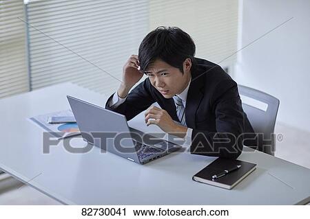 Japanese businessman in the office View Large Photo Image Stock Image - Japanese businessman in the office. Fotosearch