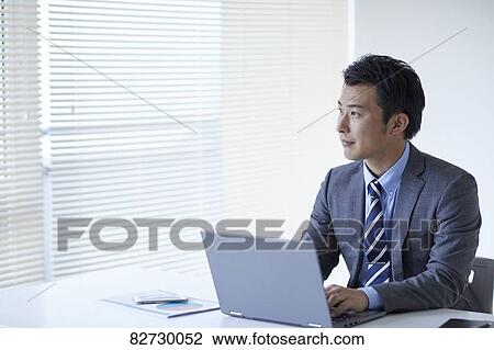 Japanese businessman in the office View Large Photo Image Stock Image - Japanese businessman in the office. Fotosearch