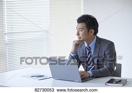 Japanese businessman in the office View Large Photo Image Stock Image - Japanese businessman in the office. Fotosearch