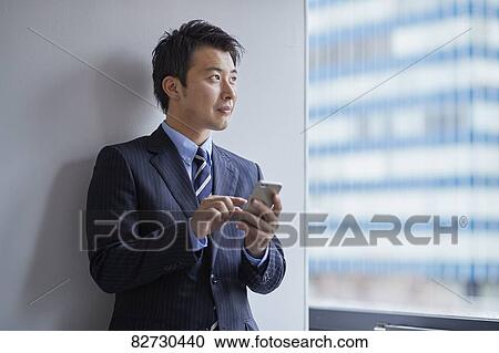 Japanese businessman in the office View Large Photo Image Stock Image - Japanese businessman in the office. Fotosearch