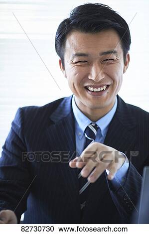 Stock Image - Japanese businessman in the office. Fotosearch