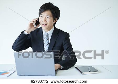 Stock Image - Japanese businessman in the office. Fotosearch