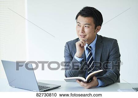 Japanese businessman in the office View Large Photo Image Stock Image - Japanese businessman in the office. Fotosearch