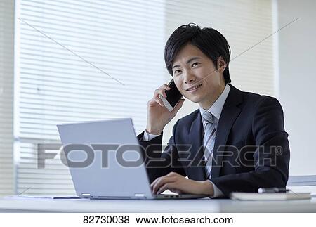 Japanese businessman in the office View Large Photo Image Stock Photo - Japanese businessman in the office. Fotosearch