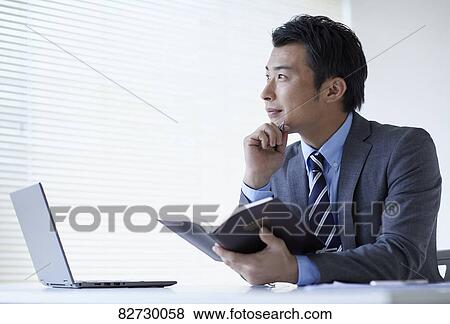 Japanese businessman in the office View Large Photo Image Stock Photo - Japanese businessman in the office. Fotosearch