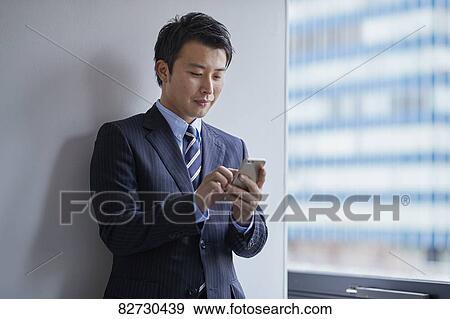 Japanese businessman in the office View Large Photo Image Stock Photo - Japanese businessman in the office. Fotosearch
