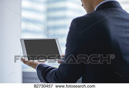 Stock Photo - Japanese businessman in the office. Fotosearch