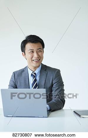 Stock Photo - Japanese businessman in the office. Fotosearch
