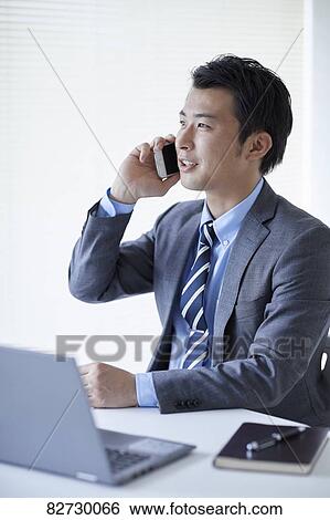 Japanese businessman in the office View Large Photo Image Stock Photograph - Japanese businessman in the office. Fotosearch