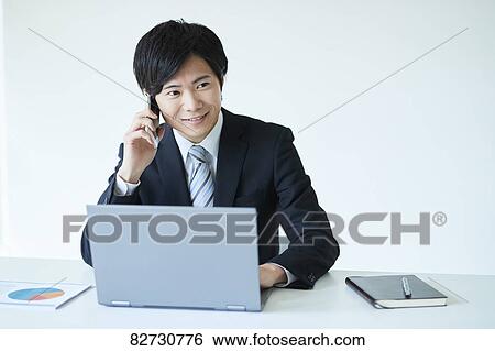 Japanese businessman in the office View Large Photo Image Stock Photograph - Japanese businessman in the office. Fotosearch