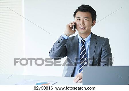 Japanese businessman in the office View Large Photo Image Stock Photograph - Japanese businessman in the office. Fotosearch