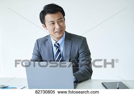 Japanese businessman in the office View Large Photo Image Stock Photography - Japanese businessman in the office. Fotosearch
