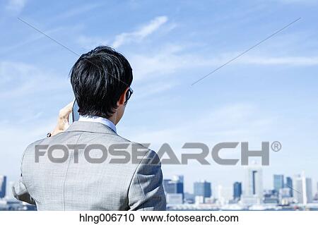Japanese businessman on the phone downtown Tokyo, Japan View Large Photo Image Stock Image - Japanese businessman on the phone downtown Tokyo, Japan. Fotosearch