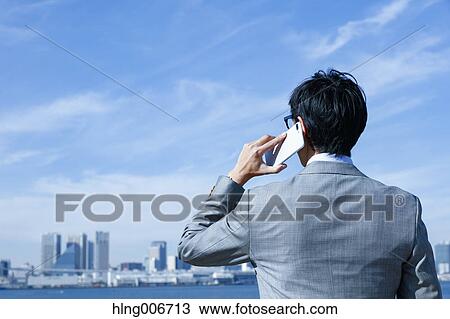 Japanese businessman on the phone downtown Tokyo, Japan View Large Photo Image Stock Image - Japanese businessman on the phone downtown Tokyo, Japan. Fotosearch