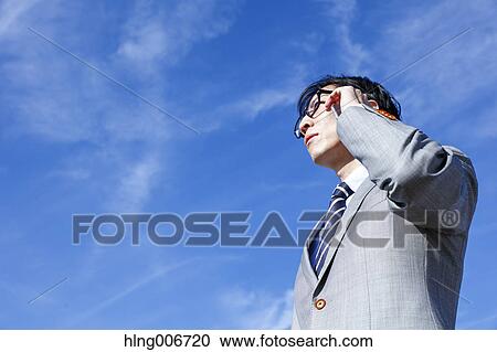 Japanese businessman on the phone downtown Tokyo, Japan View Large Photo Image Stock Image - Japanese businessman on the phone downtown Tokyo, Japan. Fotosearch