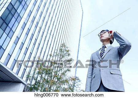 Japanese businessman on the phone downtown Tokyo, Japan View Large Photo Image Stock Image - Japanese businessman on the phone downtown Tokyo, Japan. Fotosearch