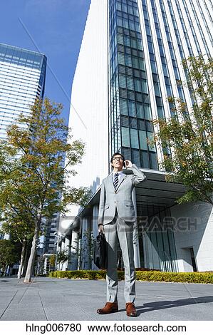 Japanese businessman on the phone downtown Tokyo, Japan View Large Photo Image Stock Image - Japanese businessman on the phone downtown Tokyo, Japan. Fotosearch