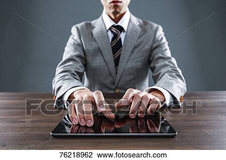 Japanese businessman working at desk View Large Photo Image Stock Image - Japanese businessman working at desk. Fotosearch