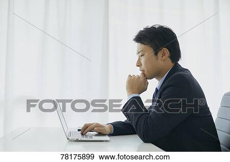 Japanese businessman working View Large Photo Image Stock Photo - Japanese businessman working. Fotosearch