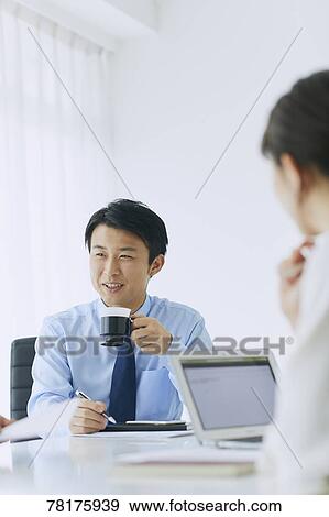 Japanese businessman working View Large Photo Image Stock Photo - Japanese businessman working. Fotosearch